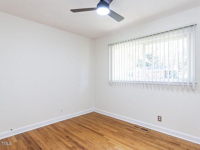 3818 Hillgrand Dr, Durham, NC 27705 - empty room with baseboards, a ceiling fan, light wood finished floors, and visible vents