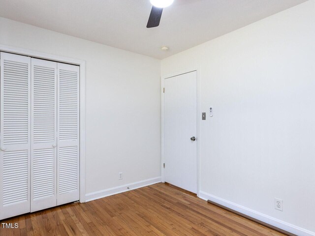 3818 Hillgrand Dr, Durham, NC 27705 - unfurnished bedroom featuring wood finished floors, a closet, a ceiling fan, and baseboards