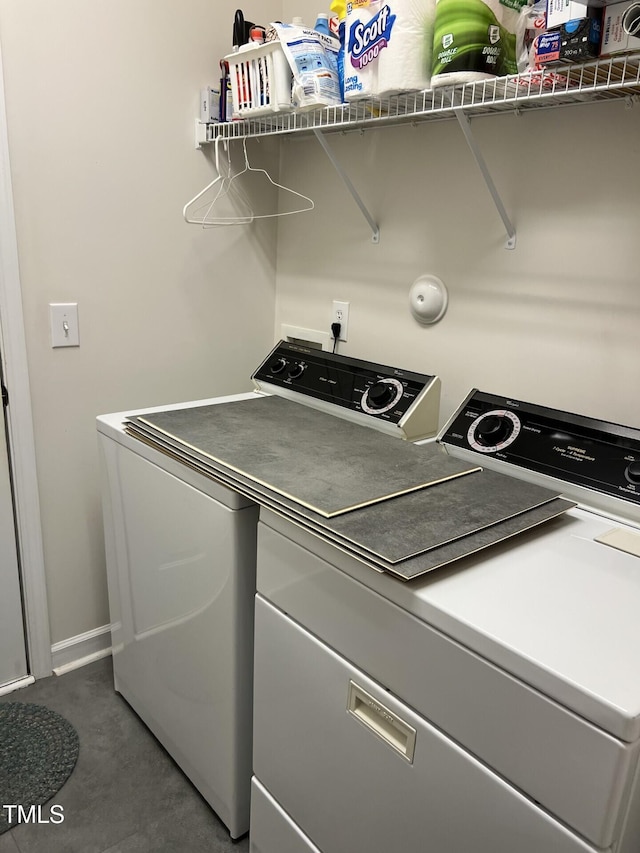 laundry area with washing machine and clothes dryer and laundry area