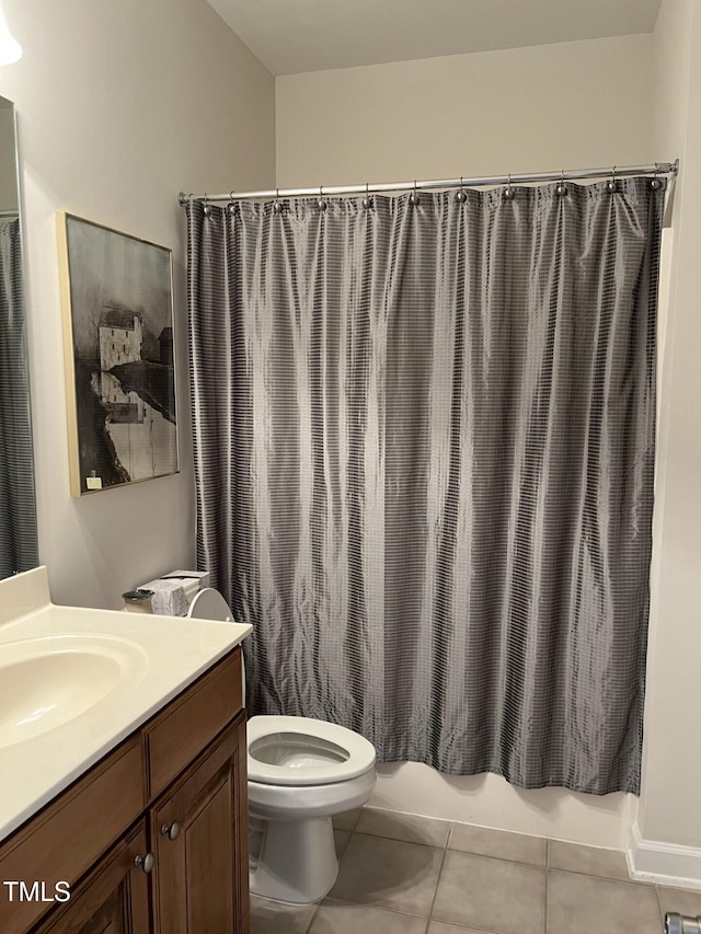 full bath with toilet, tile patterned flooring, shower / tub combo, and vanity