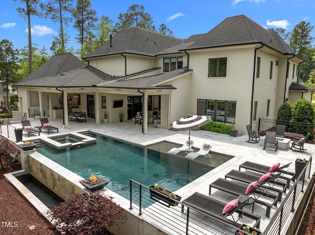 1416 Bailey Hill Dr, Raleigh, NC 27614 - back of property featuring a patio area, a shingled roof, an outdoor fire pit, and a pool with connected hot tub