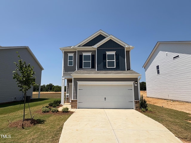 152 Bruce Dr, Dunn, NC 28334 - craftsman inspired home featuring board and batten siding, a front yard, an attached garage, concrete driveway, and stone siding