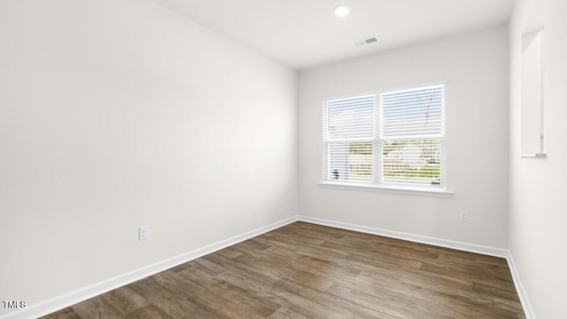 404 Ember St, Sanford, NC 27330 - unfurnished room featuring visible vents, baseboards, wood finished floors, and recessed lighting