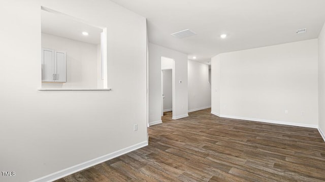 404 Ember St, Sanford, NC 27330 - spare room featuring dark wood finished floors, baseboards, visible vents, and recessed lighting