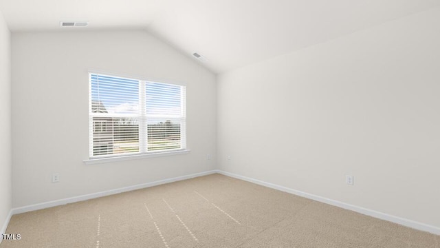 404 Ember St, Sanford, NC 27330 - carpeted spare room with lofted ceiling, visible vents, and baseboards