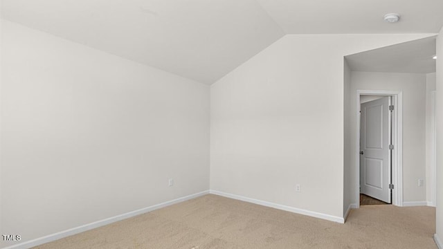 404 Ember St, Sanford, NC 27330 - bonus room featuring vaulted ceiling, baseboards, and light colored carpet