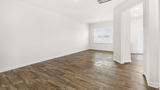 404 Ember St, Sanford, NC 27330 - spare room with baseboards, visible vents, recessed lighting, and dark wood-type flooring