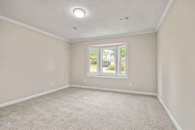 108 Carmichael Ln, Spring Lake, NC 28390 - carpeted spare room with ornamental molding, a textured ceiling, visible vents, and baseboards