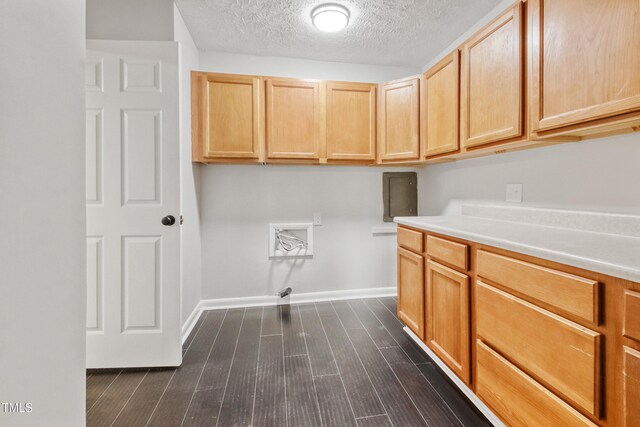 108 Carmichael Ln, Spring Lake, NC 28390 - washroom featuring cabinet space, dark wood-type flooring, hookup for a washing machine, baseboards, and a textured ceiling