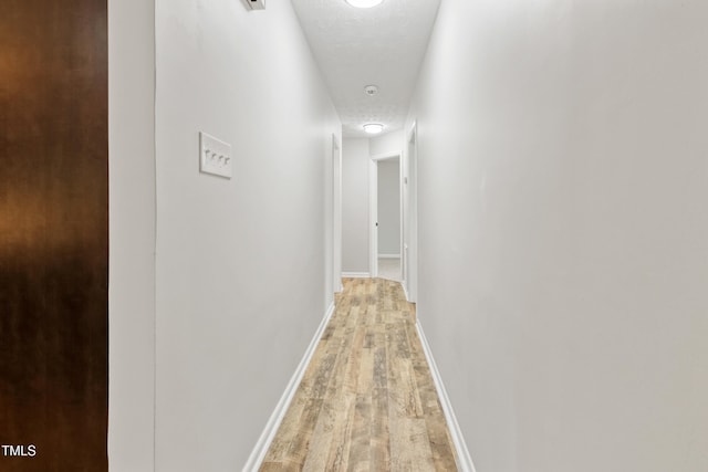 108 Carmichael Ln, Spring Lake, NC 28390 - hallway featuring baseboards and light wood-type flooring