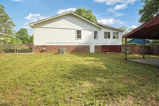 108 Carmichael Ln, Spring Lake, NC 28390 - rear view of property with fence, central AC unit, a yard, and crawl space