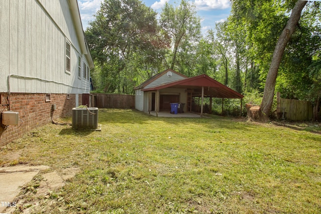 108 Carmichael Ln, Spring Lake, NC 28390 - view of yard with fence, central AC, and a garage