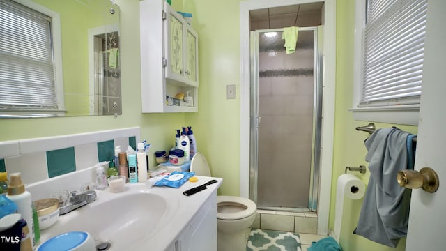 1011 Wyldewood Rd, Durham, NC 27704 - bathroom with toilet, a stall shower, vanity, and plenty of natural light