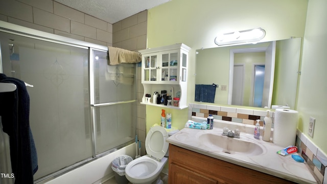 1011 Wyldewood Rd, Durham, NC 27704 - full bathroom featuring enclosed tub / shower combo, toilet, and vanity