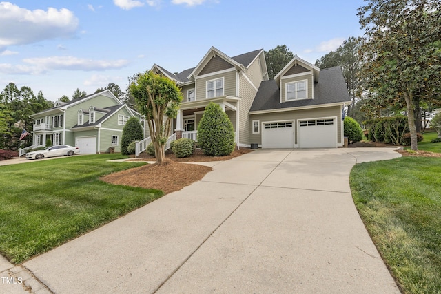 925 Hidden Jewel Ln, Wake Forest, NC 27587 - craftsman-style home featuring a garage, driveway, a front yard, and roof with shingles
