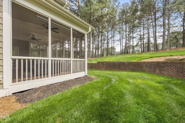 925 Hidden Jewel Ln, Wake Forest, NC 27587 - view of grassy yard with a ceiling fan, a sunroom, and view of wooded area