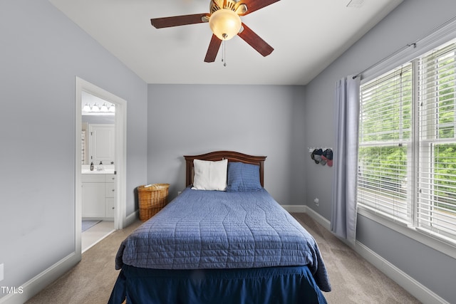 925 Hidden Jewel Ln, Wake Forest, NC 27587 - bedroom with light colored carpet, multiple windows, and ensuite bathroom