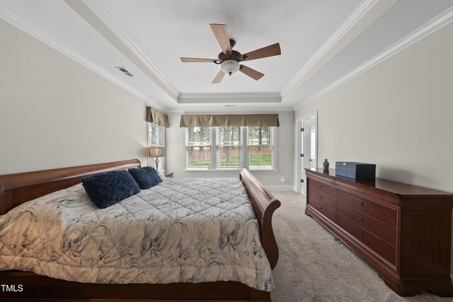 925 Hidden Jewel Ln, Wake Forest, NC 27587 - carpeted bedroom with a tray ceiling, crown molding, ceiling fan, and baseboards