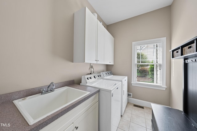 925 Hidden Jewel Ln, Wake Forest, NC 27587 - clothes washing area with separate washer and dryer, cabinet space, and light tile patterned floors