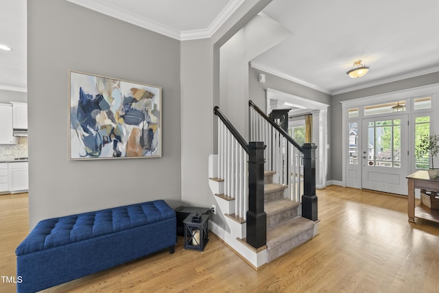 925 Hidden Jewel Ln, Wake Forest, NC 27587 - entryway featuring light wood-style floors, crown molding, stairway, and baseboards