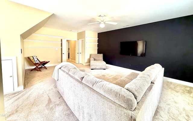 925 Hidden Jewel Ln, Wake Forest, NC 27587 - living room with carpet floors, a ceiling fan, and an accent wall