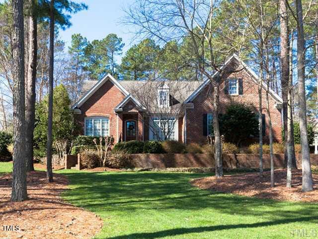 5401 Fire Pink Way, Raleigh, NC 27613 - traditional home with brick siding and a front lawn