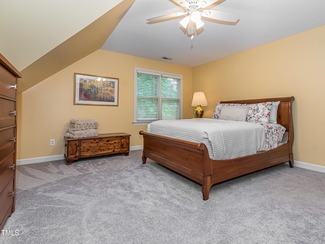 5401 Fire Pink Way, Raleigh, NC 27613 - carpeted bedroom with baseboards, a ceiling fan, and vaulted ceiling
