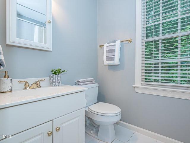 5401 Fire Pink Way, Raleigh, NC 27613 - bathroom featuring vanity, tile patterned floors, toilet, baseboards, and a shower with shower curtain