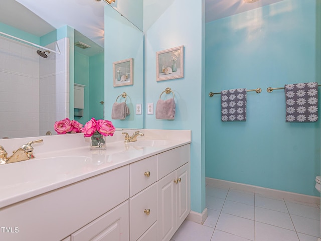 5401 Fire Pink Way, Raleigh, NC 27613 - full bath featuring toilet, tile patterned floors, double vanity, baseboards, and a shower
