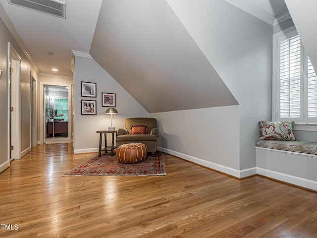 5401 Fire Pink Way, Raleigh, NC 27613 - sitting room with ornamental molding, wood finished floors, baseboards, and vaulted ceiling