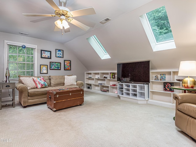 5401 Fire Pink Way, Raleigh, NC 27613 - living area featuring a skylight, carpet floors, lofted ceiling, and a ceiling fan