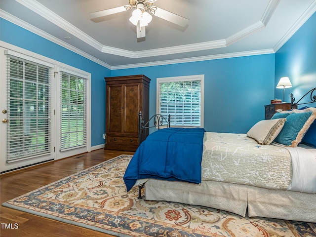 5401 Fire Pink Way, Raleigh, NC 27613 - bedroom featuring access to exterior, multiple windows, a raised ceiling, and crown molding
