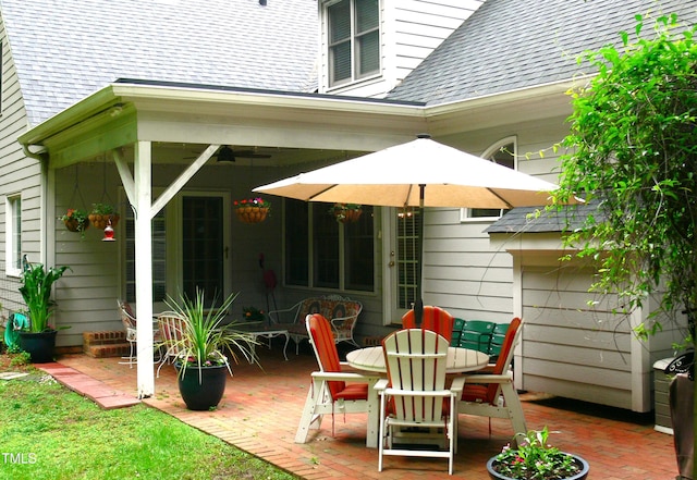 5401 Fire Pink Way, Raleigh, NC 27613 - rear view of house with a patio, roof with shingles, and outdoor dining space