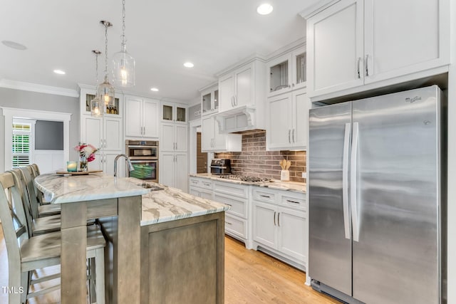 128 Paraggi Ct, Clayton, NC 27527 - kitchen featuring a sink, appliances with stainless steel finishes, backsplash, and white cabinets