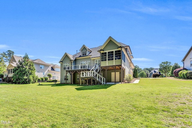 128 Paraggi Ct, Clayton, NC 27527 - back of property with a sunroom, a yard, stairway, and a deck