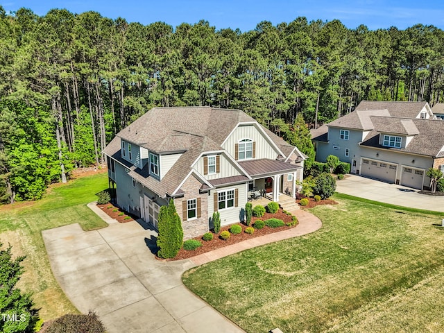 128 Paraggi Ct, Clayton, NC 27527 - view of front of property with a garage, board and batten siding, stone siding, and concrete driveway