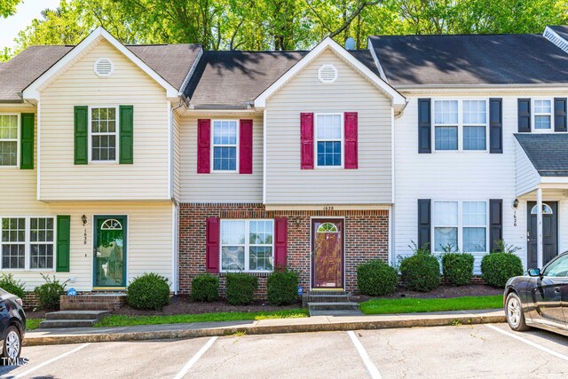 1628 Briarmont Ct, Raleigh, NC 27610 - townhome / multi-family property featuring uncovered parking and brick siding