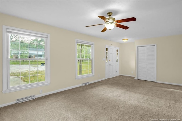 9701 Rockfish Rd, Fayetteville, NC 28376 - spare room featuring a ceiling fan, plenty of natural light, and carpet floors