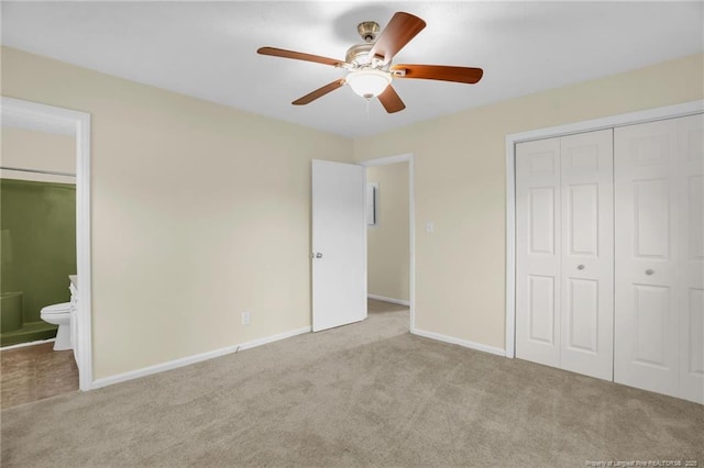 9701 Rockfish Rd, Fayetteville, NC 28376 - unfurnished bedroom with carpet floors, a closet, baseboards, ensuite bathroom, and a ceiling fan