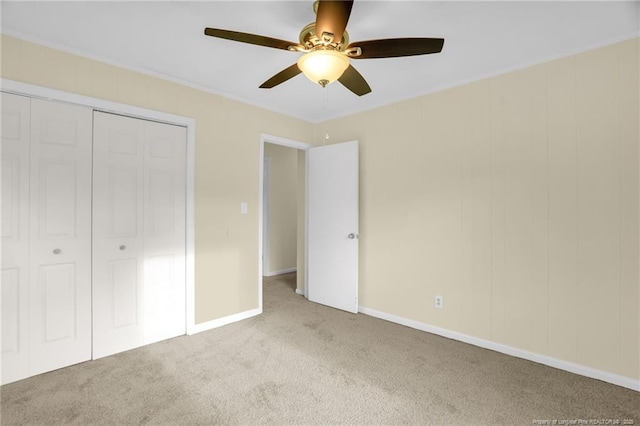 9701 Rockfish Rd, Fayetteville, NC 28376 - unfurnished bedroom featuring carpet flooring, a closet, baseboards, and ceiling fan