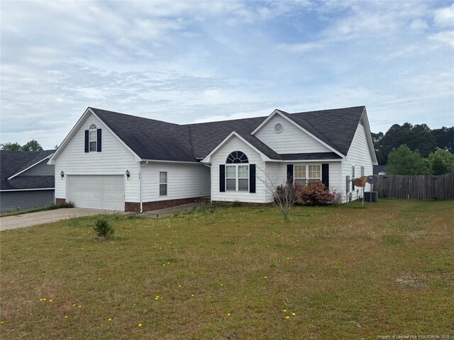 234 Walden Green Dr, Raeford, NC 28376 - view of front of house featuring a front yard, driveway, a garage, and fence