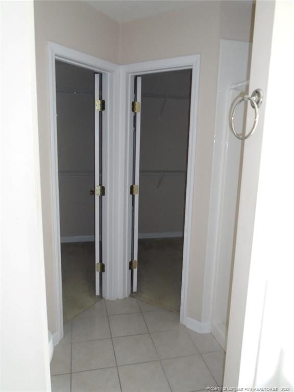 234 Walden Green Dr, Raeford, NC 28376 - hall with light tile patterned floors and baseboards