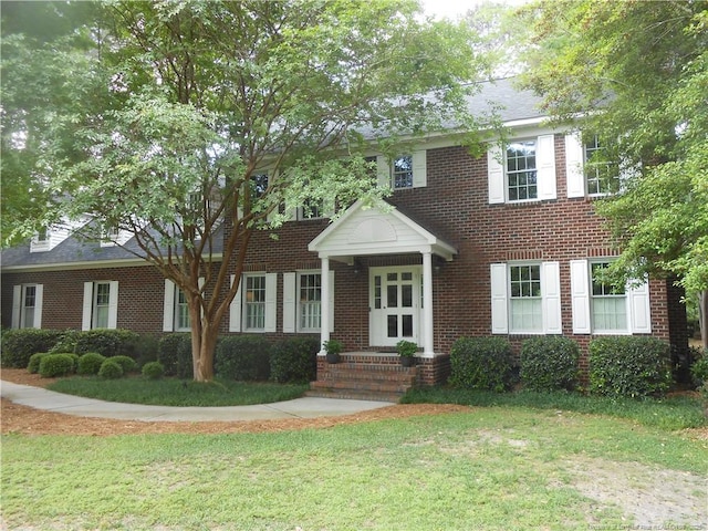 600 Yorkshire Pl, Lumberton, NC 28358 - colonial inspired home featuring a front lawn and brick siding