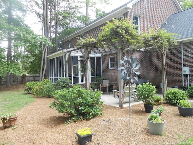 600 Yorkshire Pl, Lumberton, NC 28358 - back of property with fence, a patio area, a sunroom, and brick siding
