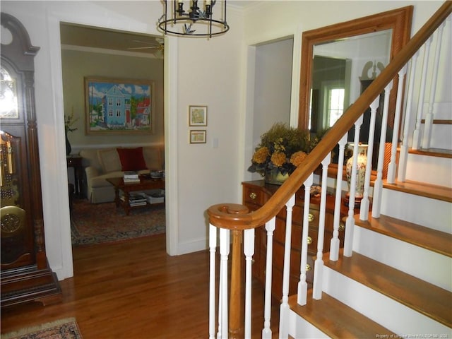 600 Yorkshire Pl, Lumberton, NC 28358 - stairs with ornamental molding, a chandelier, and wood finished floors