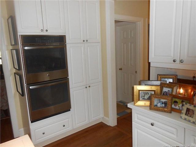 600 Yorkshire Pl, Lumberton, NC 28358 - kitchen with double oven, light countertops, dark wood finished floors, baseboards, and white cabinetry
