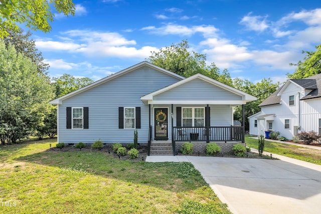 bungalow featuring crawl space, covered porch, and a front yard