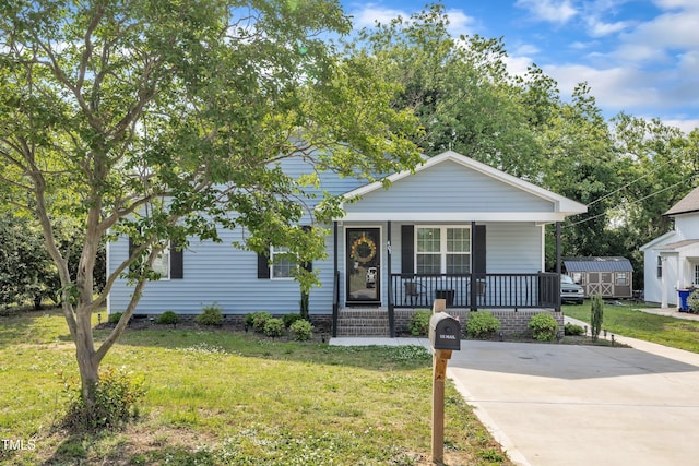 bungalow with a porch and a front yard