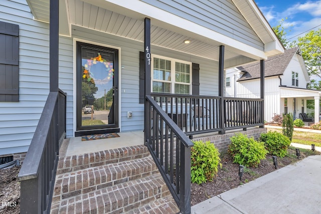 doorway to property featuring a porch