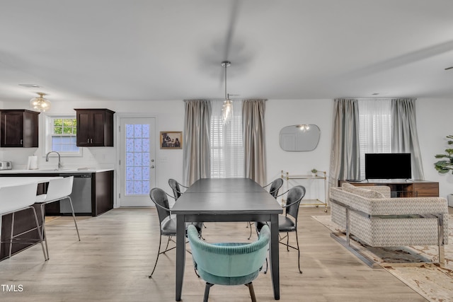 dining space with light wood-style floors